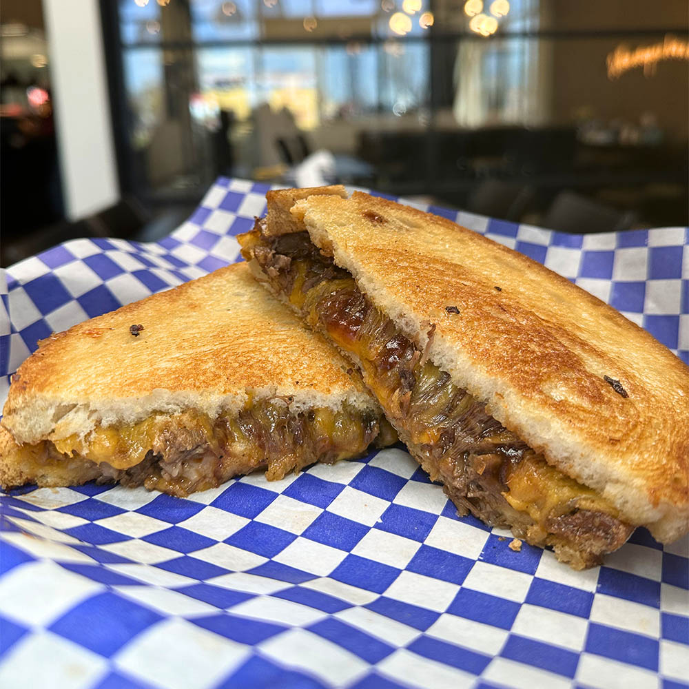 The Boss BBQ brisket grilled cheese sandwich with sharp cheddar on sourdough -- Ruthie's For Good Dallas food truck